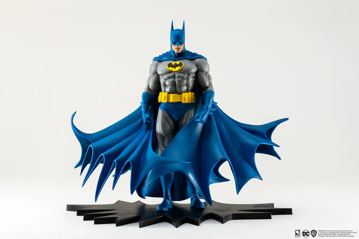 Batman PVC statue in classic grey and blue suit with large bat-shaped cape on a white background