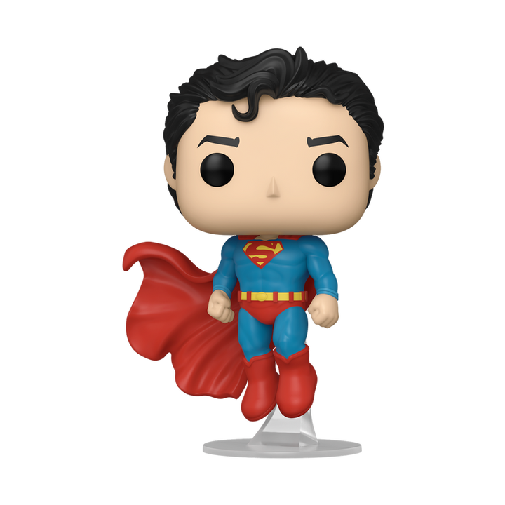 Superman figurine with red cape and blue suit on a white background