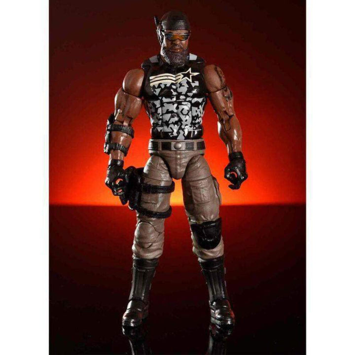 Action figure with a black and white patterned shirt against a red background