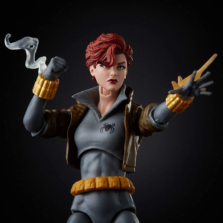 Action figure with red hair and superhero outfit on a black background