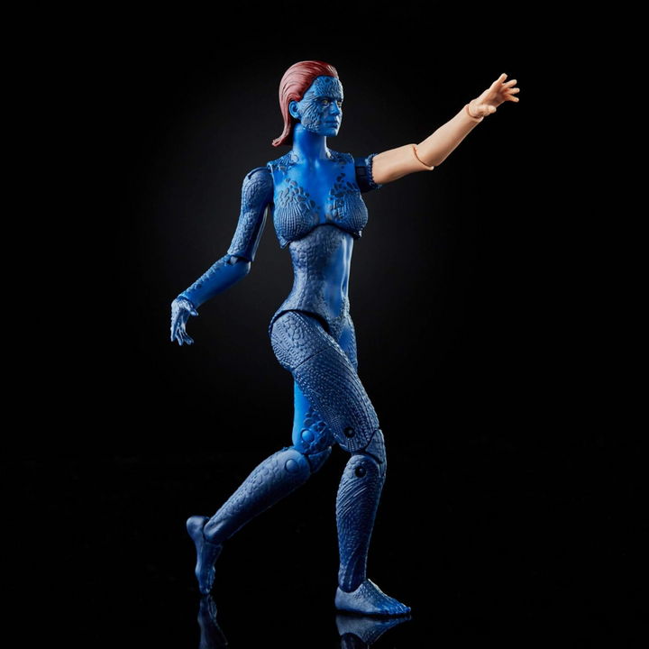 Blue superhero action figure with red hair on a black background
