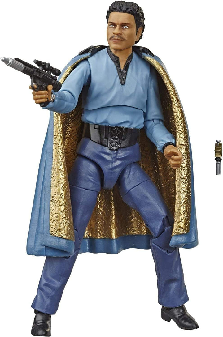Action figure in blue costume with gold accents and a gun, on a white background
