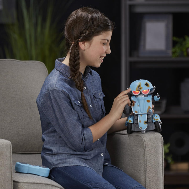 Girl playing with a robot toy on a couch