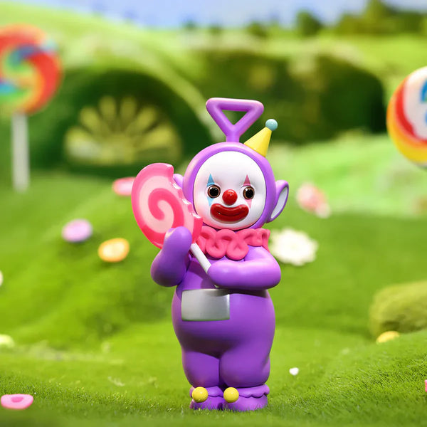 Teletubbies figure of Tinky Winky holding a candy bar