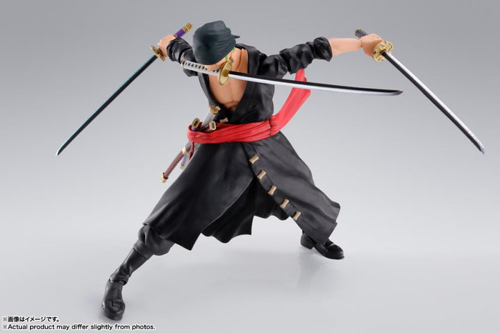 Side view of Zoro in three-sword Santoryu stance wearing black outfit and bandana on a white background