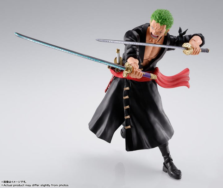 Zoro action figure with two swords drawn in a ready battle stance on a white background