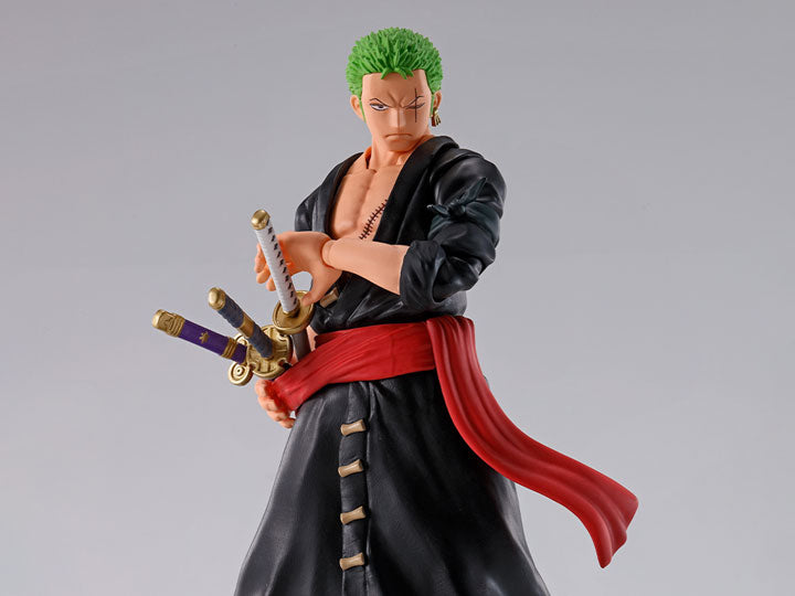Roronoa Zoro action figure in black kimono with swords sheathed on a white background